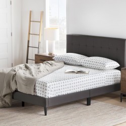 Cama con plataforma de perfil bajo y tapizado de madera maciza